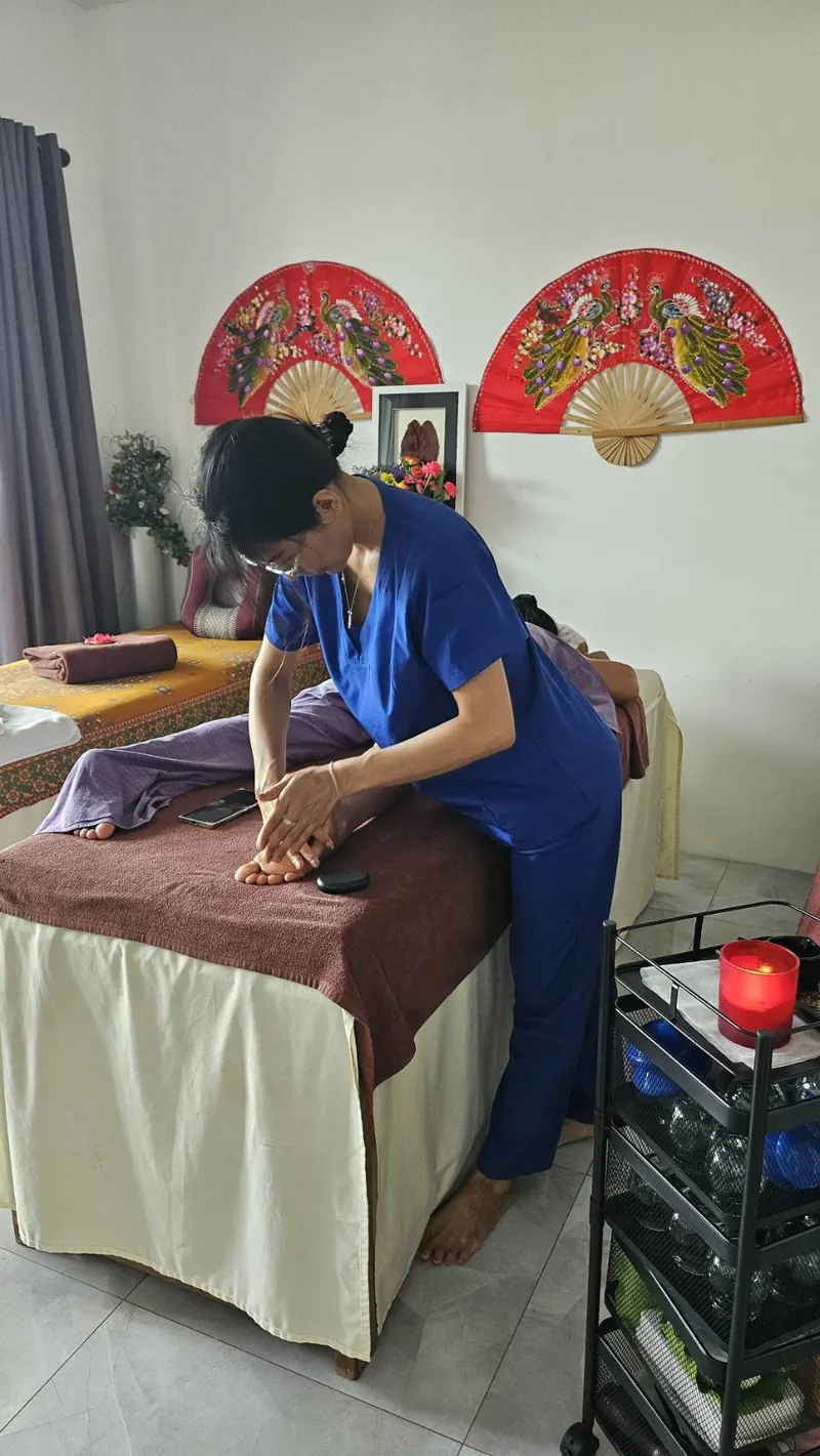 Therapist giving a traditional Thai massage